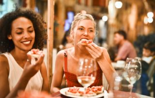 Two women enjoy a meal