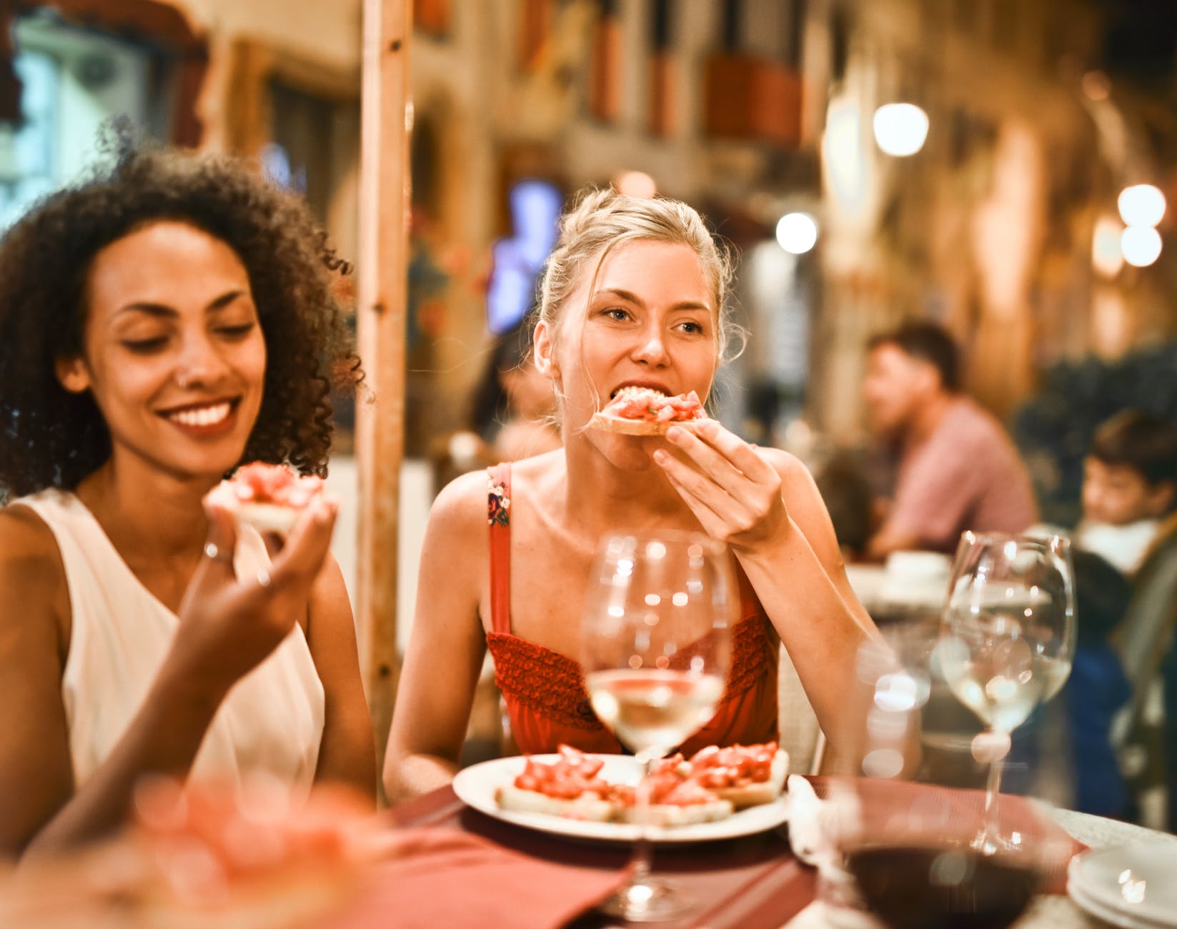 Two women enjoy a meal