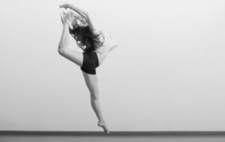 Jazz dancer leaping through the air