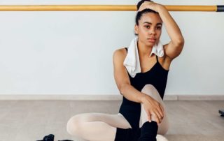 a young dancer looked stressed and tired in need of dancewear solutions