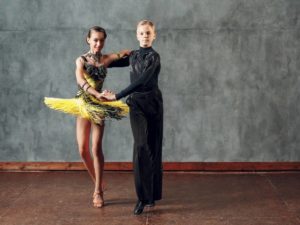 Ballroom dance partners in elaborate costumes