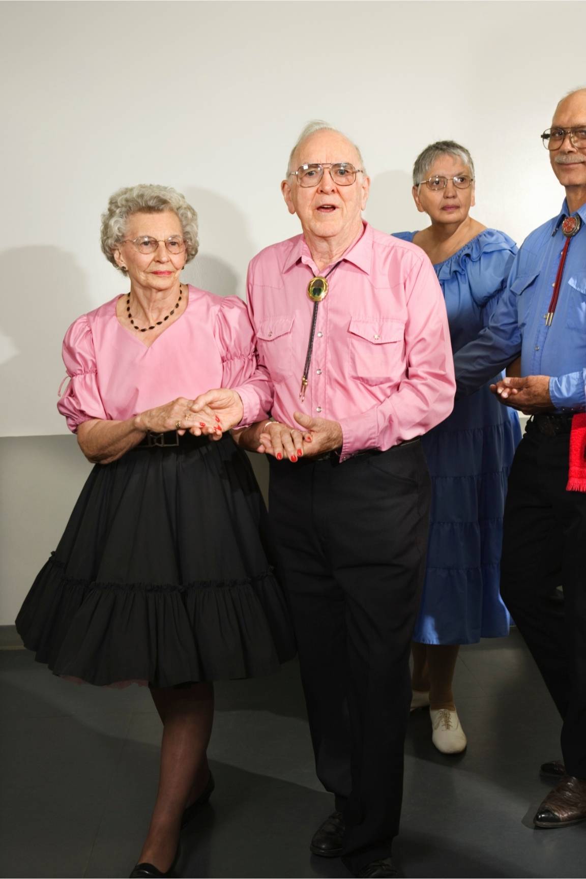 an old couple in square dance costumes