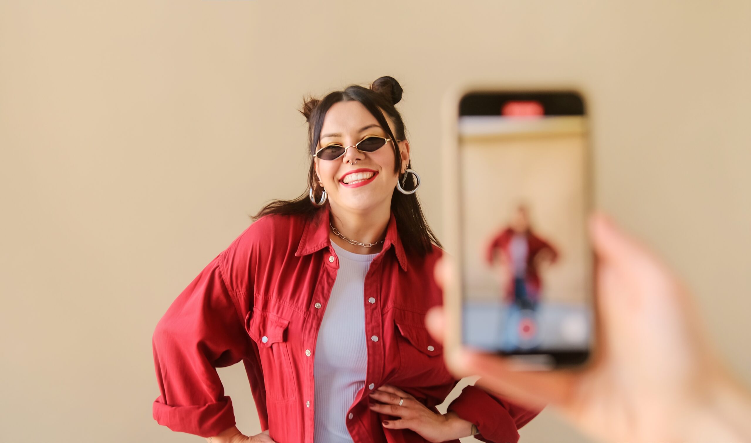 woman space buns red tiktok dance influencer video iphone