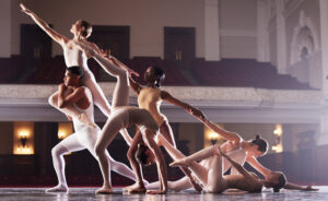 Shot of a group of diverse ballet dancers performing in a theater.