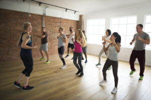 Happy diverse people in an active exercise class
