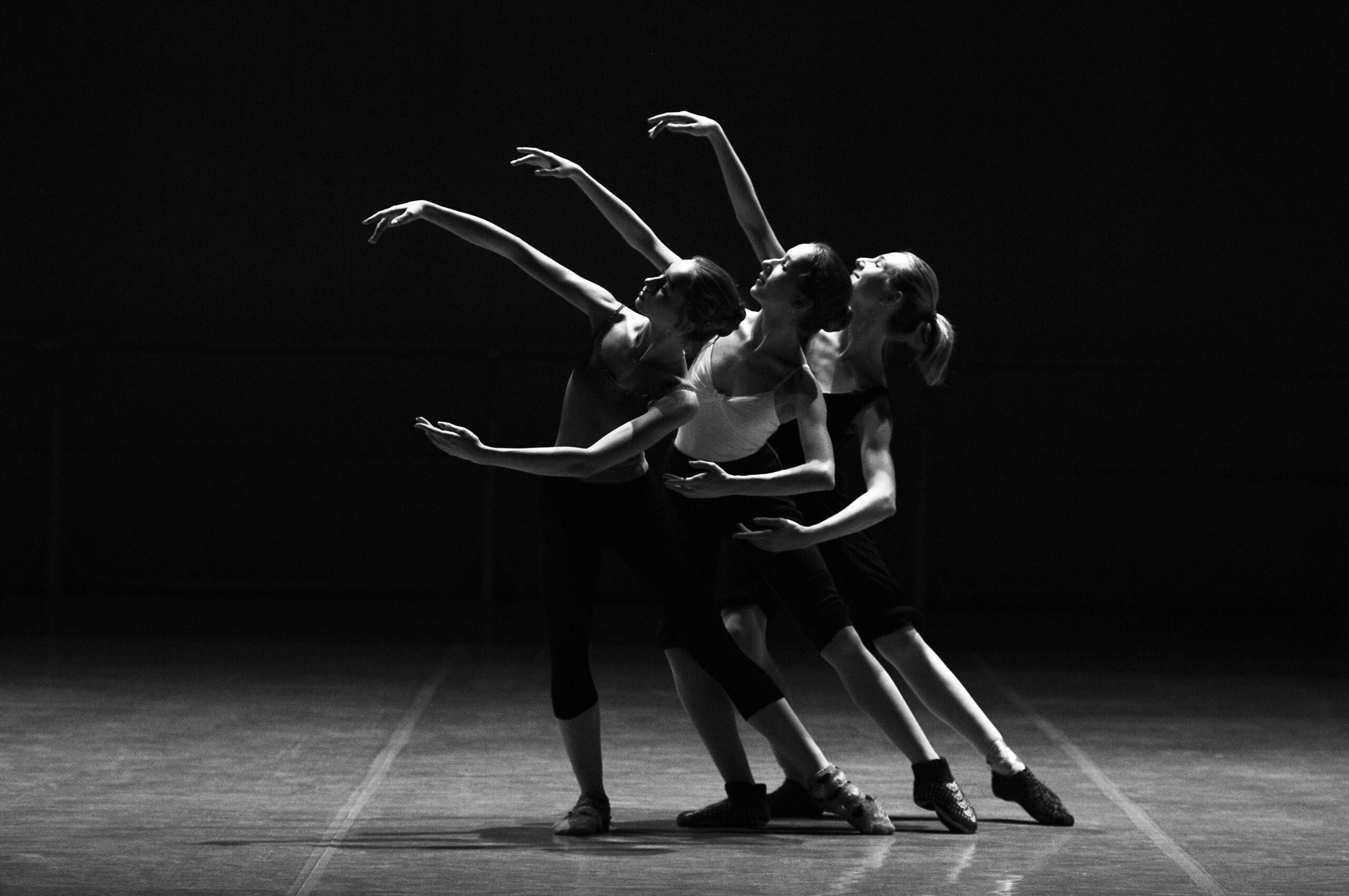 black and white b&w trio dancers on stage theatre